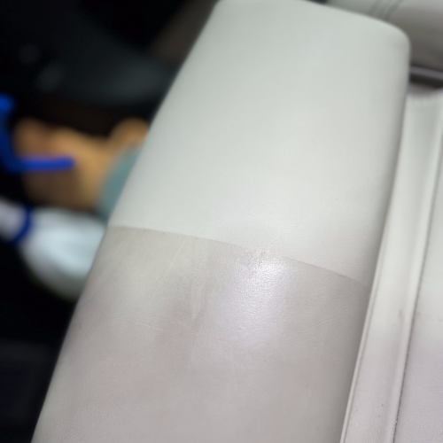 Close up of a leather sheet headrest cleaned by sharkey auto detailing perth