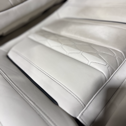 Close up of a white leather car seat cleaned by sharkey auto detailing perth