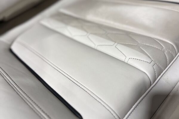 Close up of a white leather car seat cleaned by sharkey auto detailing perth